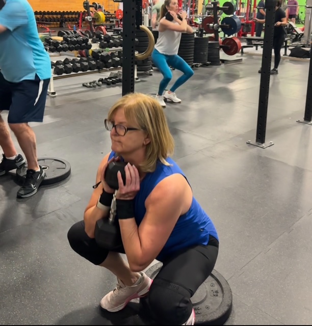 Jocelyn performing a perfect squat at age 70