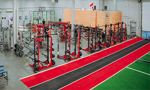Strength training area with squat racks and barbells